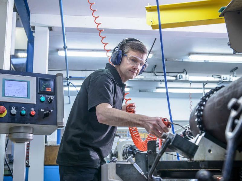 Worker performing test on machinery
