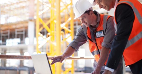 Construction Workers on Laptop