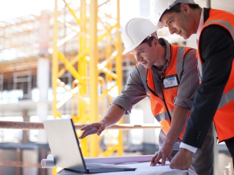 Construction Workers on Laptop